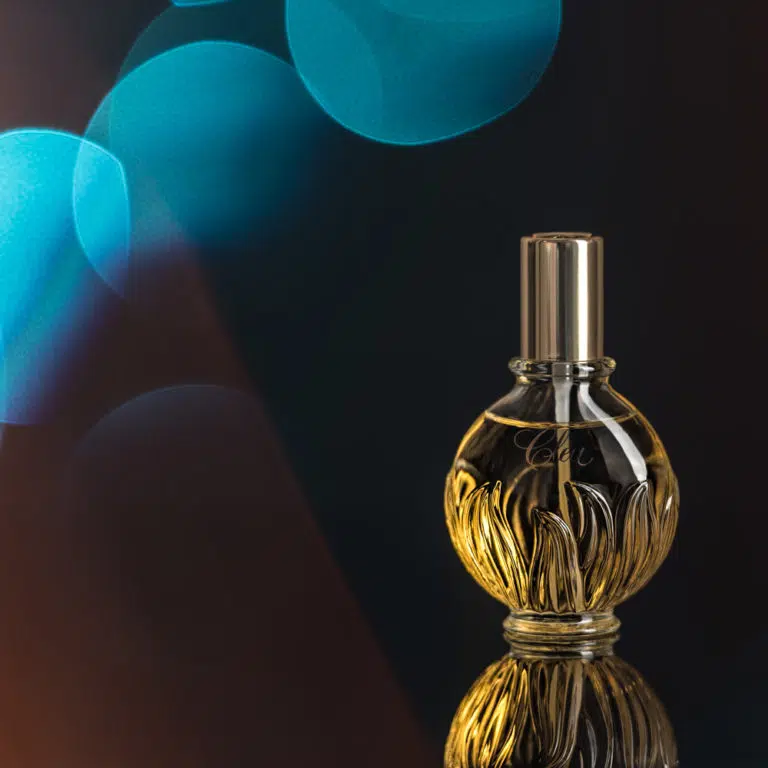 Clea perfume bottle with coloured bokeh - demo of an advertising photography special effect