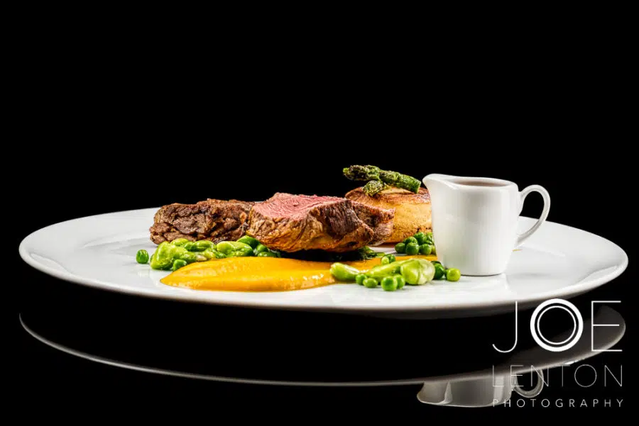 Food Photo Story - Duo of Lamb - plated with sauce in jug side view
