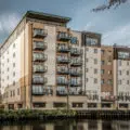 Long exposure architectural image of flats by the river in Norwich