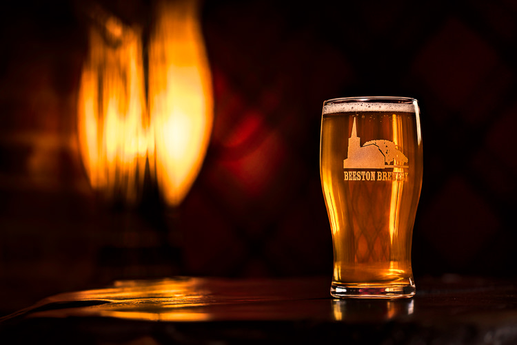 Glowing pint of beer in Beeston Brewery Glass shot at The Norfolk Lurcher