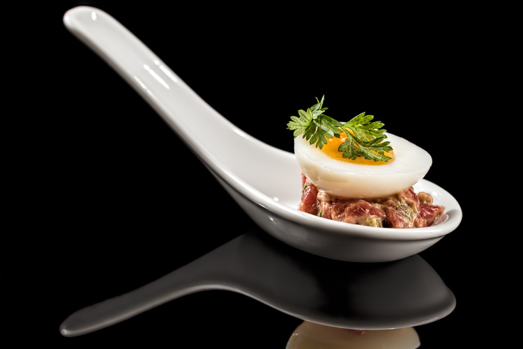 Egg & steak tartare canape served on a spoon
