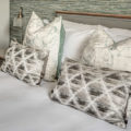Hotel photography - pillows on bed in room at Hog Hotel