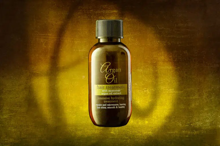 Argan Oil hair treatment oil - sample bottle advertising shot with branding used in background