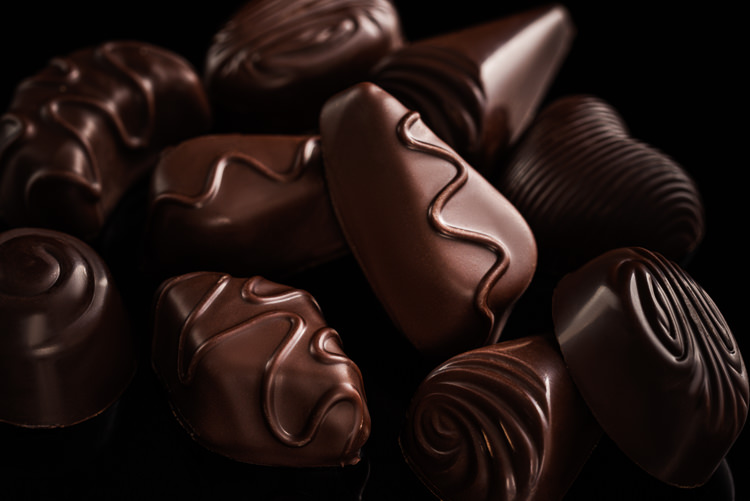 Creative Chocolate Photography - dark chocolates on dark background