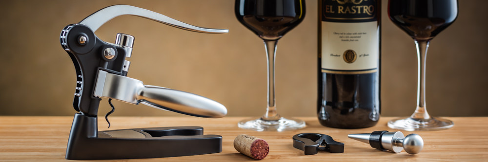Banner image showing corkscrew with wine bottle and full glasses