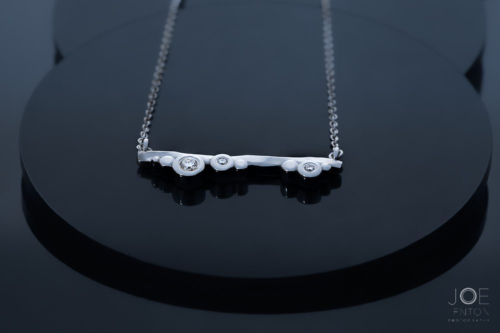 Silver necklace with diamonds - jewellery photography