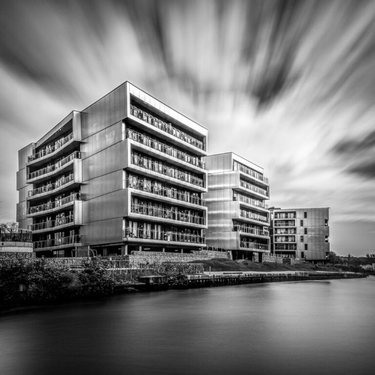Monochrome long exposure of flats along Riverside in Norwich