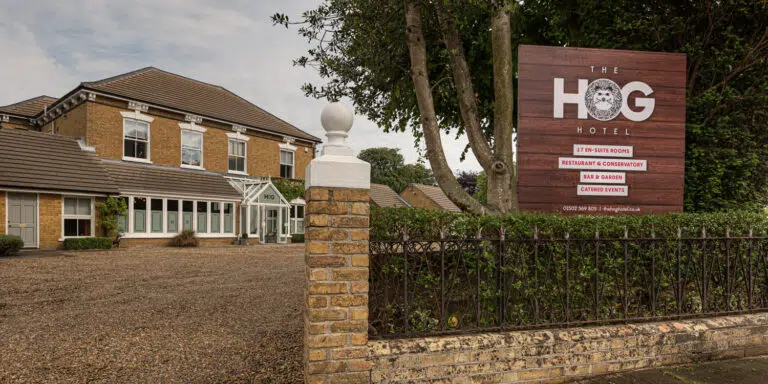 Hog Hotel viewed from the roadside with signage