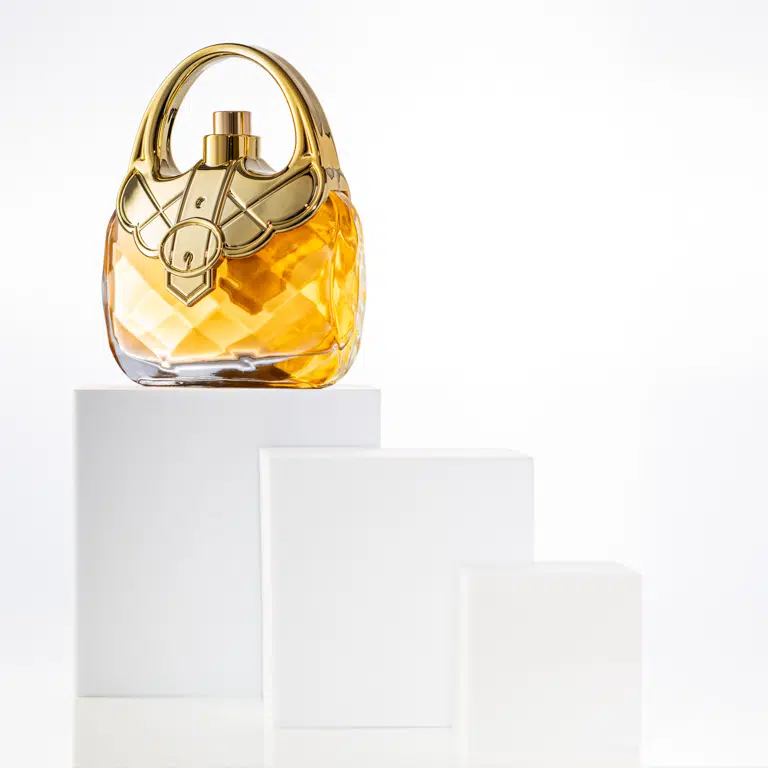 High Key Perfume Photography - Purse String bottle on white blocks